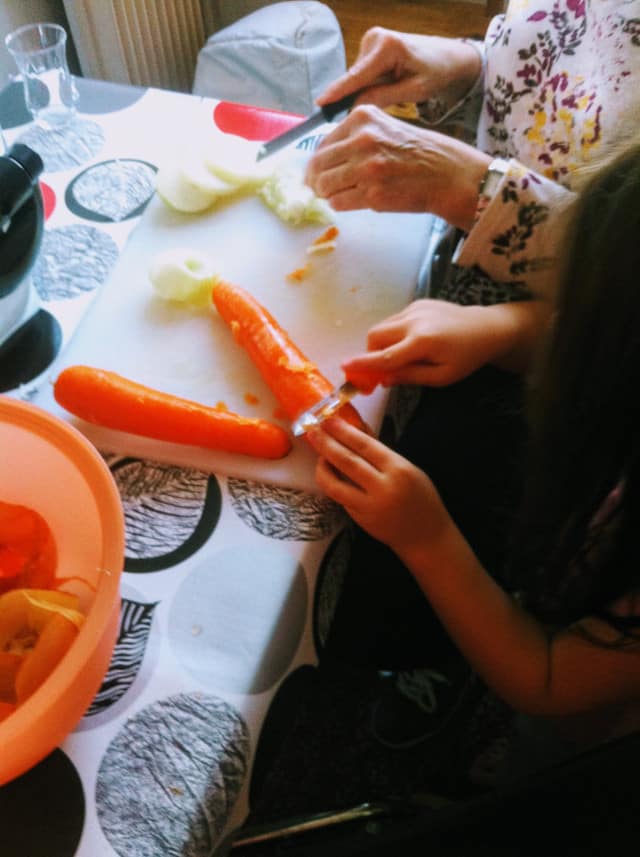 Child cutting carrots
